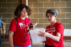 Amy Merrill Willis talks to a new student while filling our paperwork