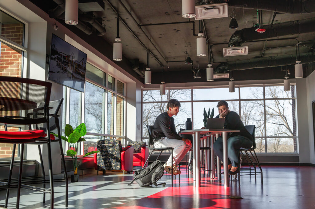 Courtney Kelsey advises a student in the Solutions Center